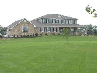 1016 Capp Road Nazareth, PA 18064 - Photo 1 of 7 a front view of a house with a garden