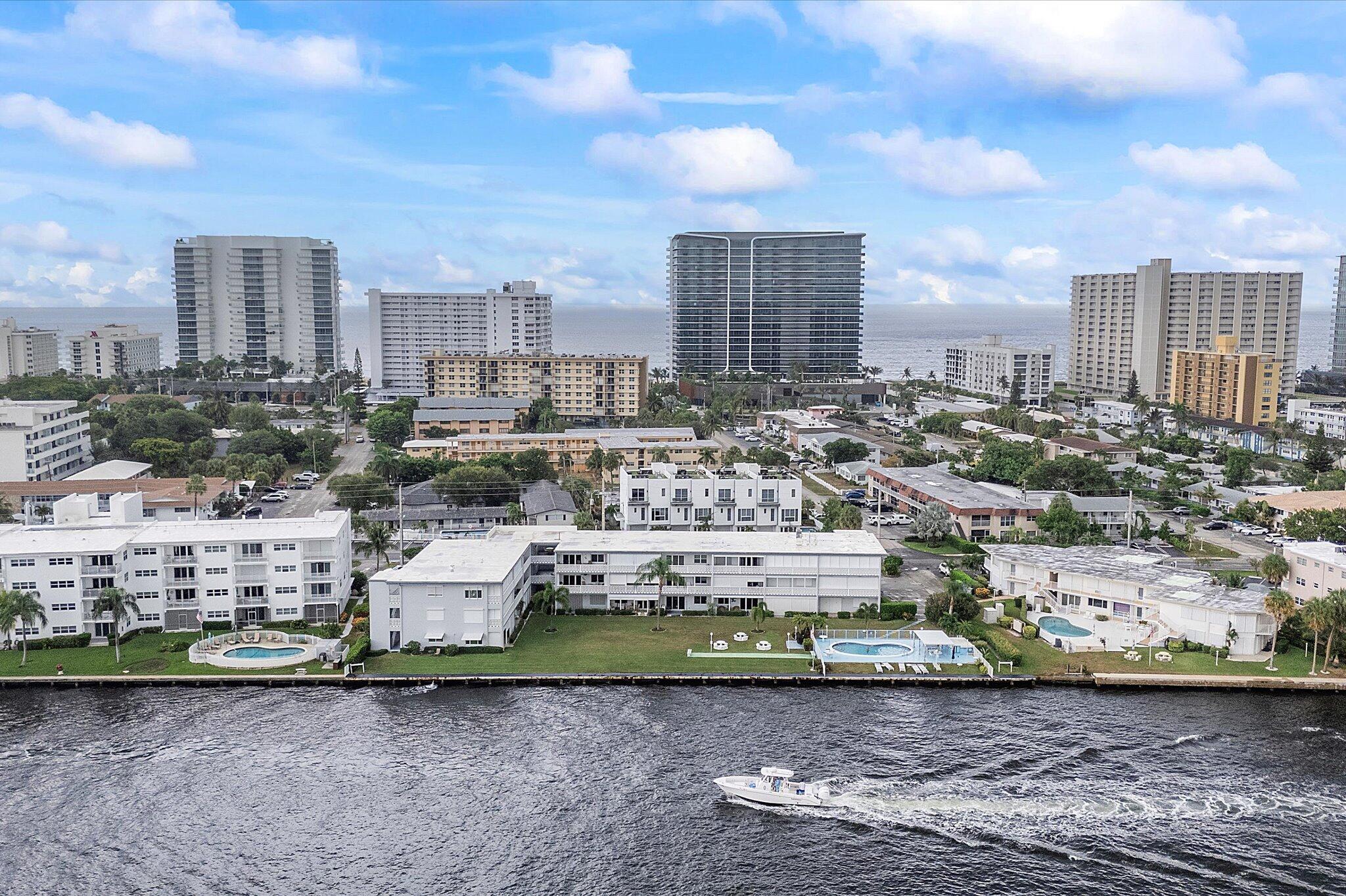 1001 North Riverside Drive, Unit 104 Pompano Beach, FL 33062 - Photo 1 of 17 a view of a city with tall buildings
