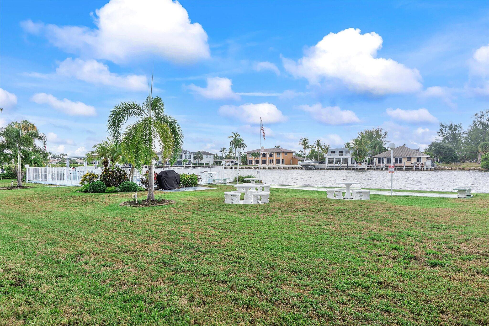 1001 North Riverside Drive, Unit 104 Pompano Beach, FL 33062 - Photo 12 of 17 a view of a garden