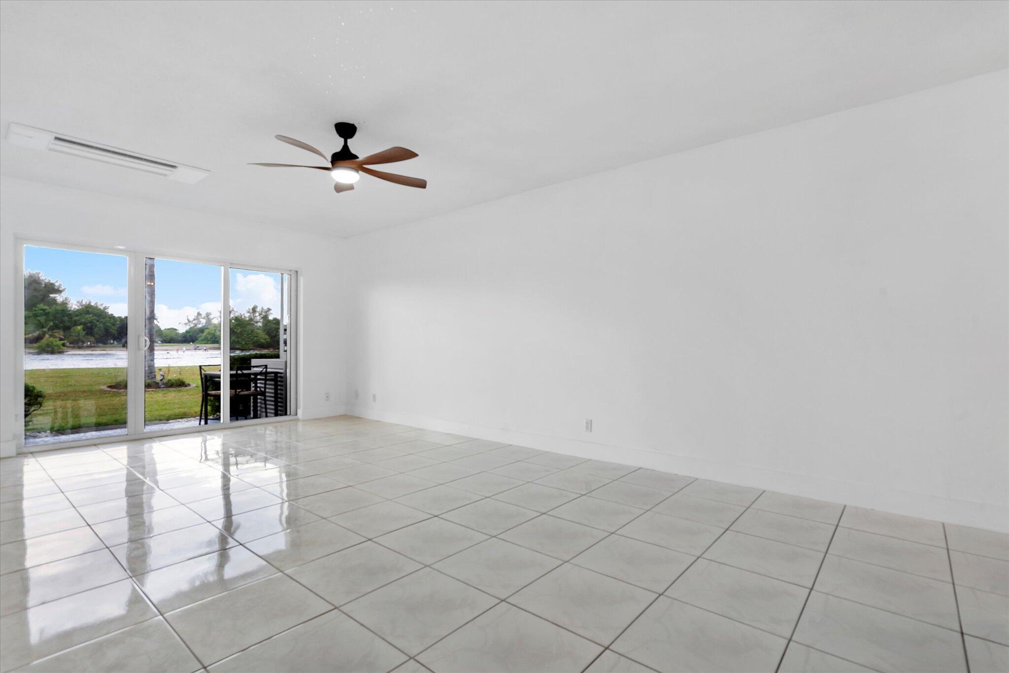 1001 North Riverside Drive, Unit 104 Pompano Beach, FL 33062 - Photo 3 of 17 a view of an entryway with a ceiling fan