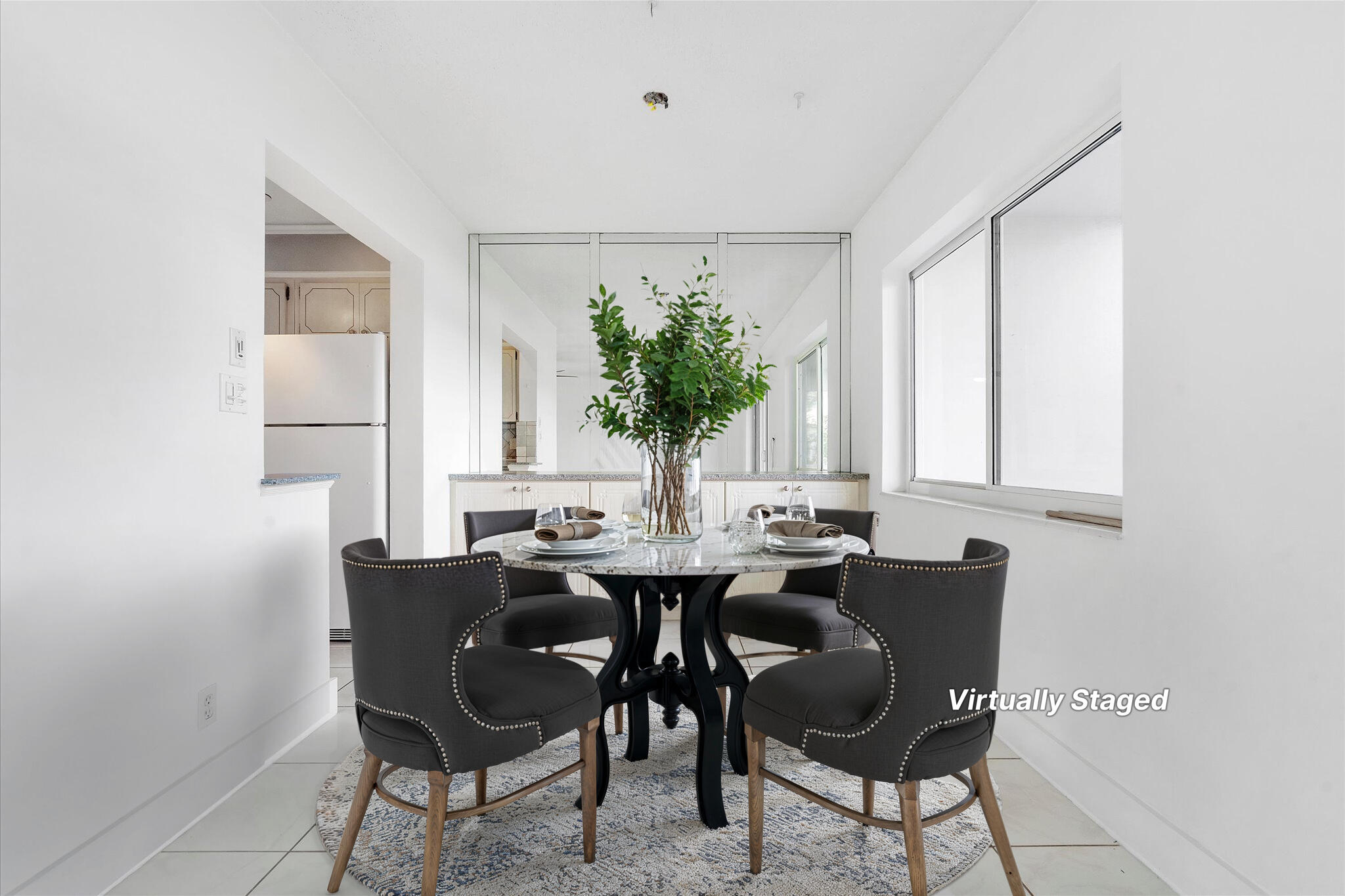 1001 North Riverside Drive, Unit 104 Pompano Beach, FL 33062 - Photo 4 of 17 a dining room with furniture and window