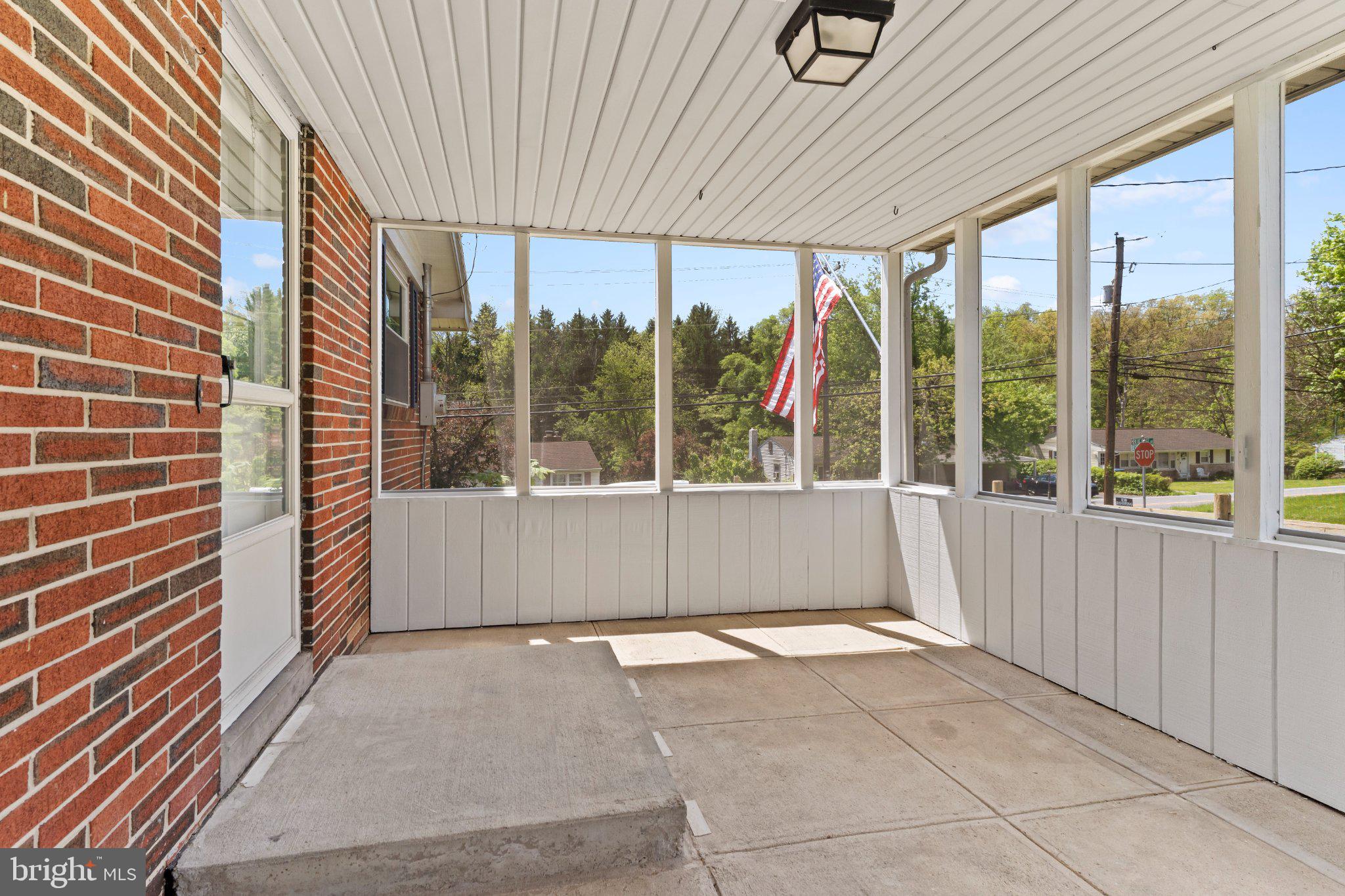 6700 Blue Ridge Avenue Harrisburg, PA 17112 - Photo 4 of 20 Inviting sunlit porch with scenic views.