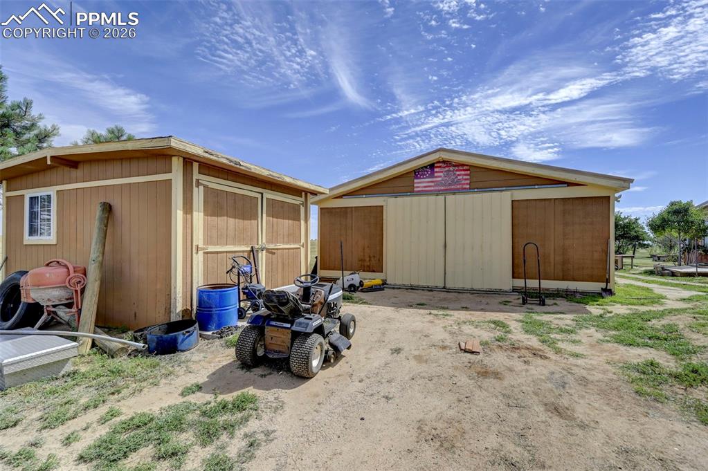 35875 Shear Road Yoder, CO 80864 - Photo 31 of 45 a backyard of a house with table and chairs