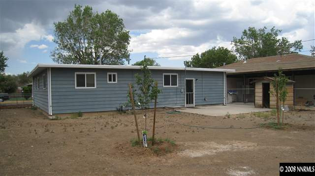 1740 Haddock Drive Reno, NV 89512 - Photo 9 of 9 a house with trees in the background