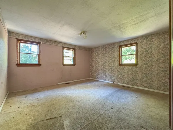 an empty room with windows