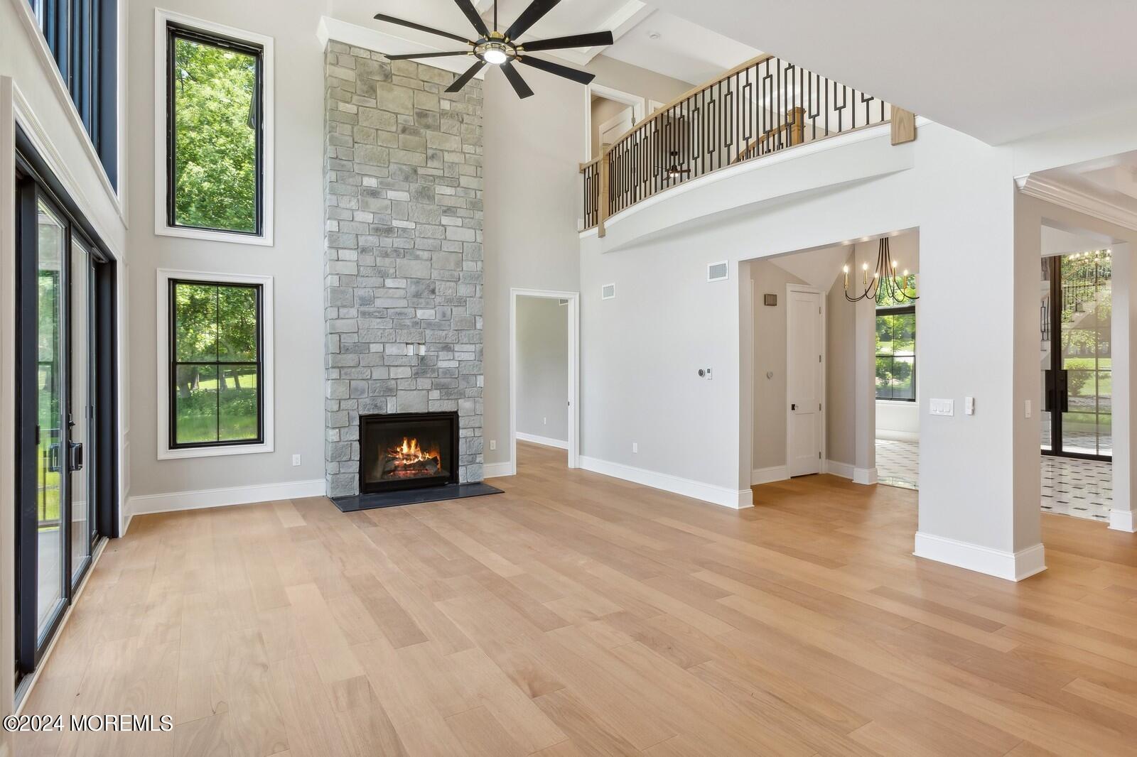 16 Round Hill Holmdel, NJ 07733 - Photo 11 of 60 a view of a livingroom with a fireplace and window