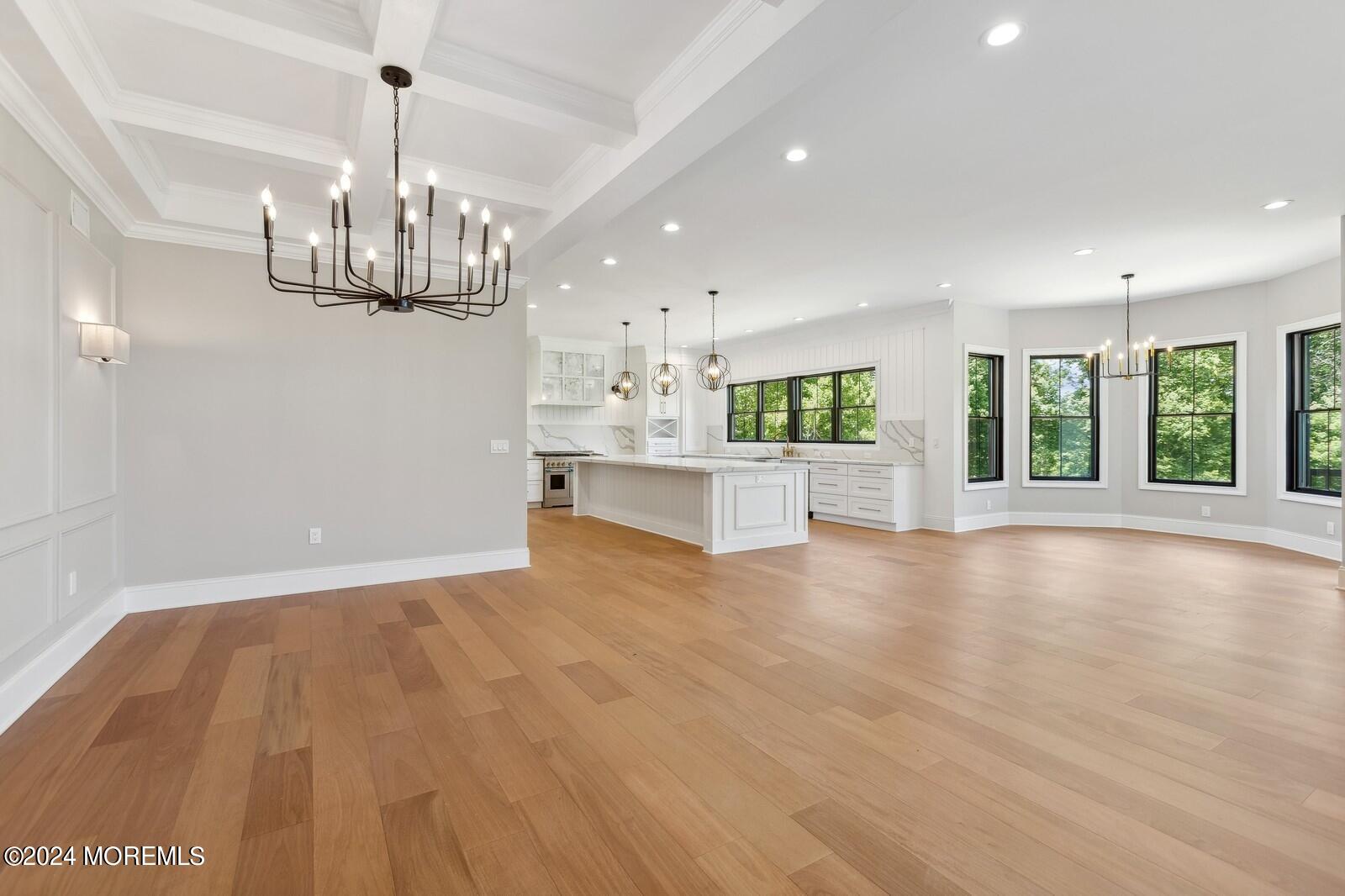 16 Round Hill Holmdel, NJ 07733 - Photo 13 of 60 a view of an empty room with window and wooden floor