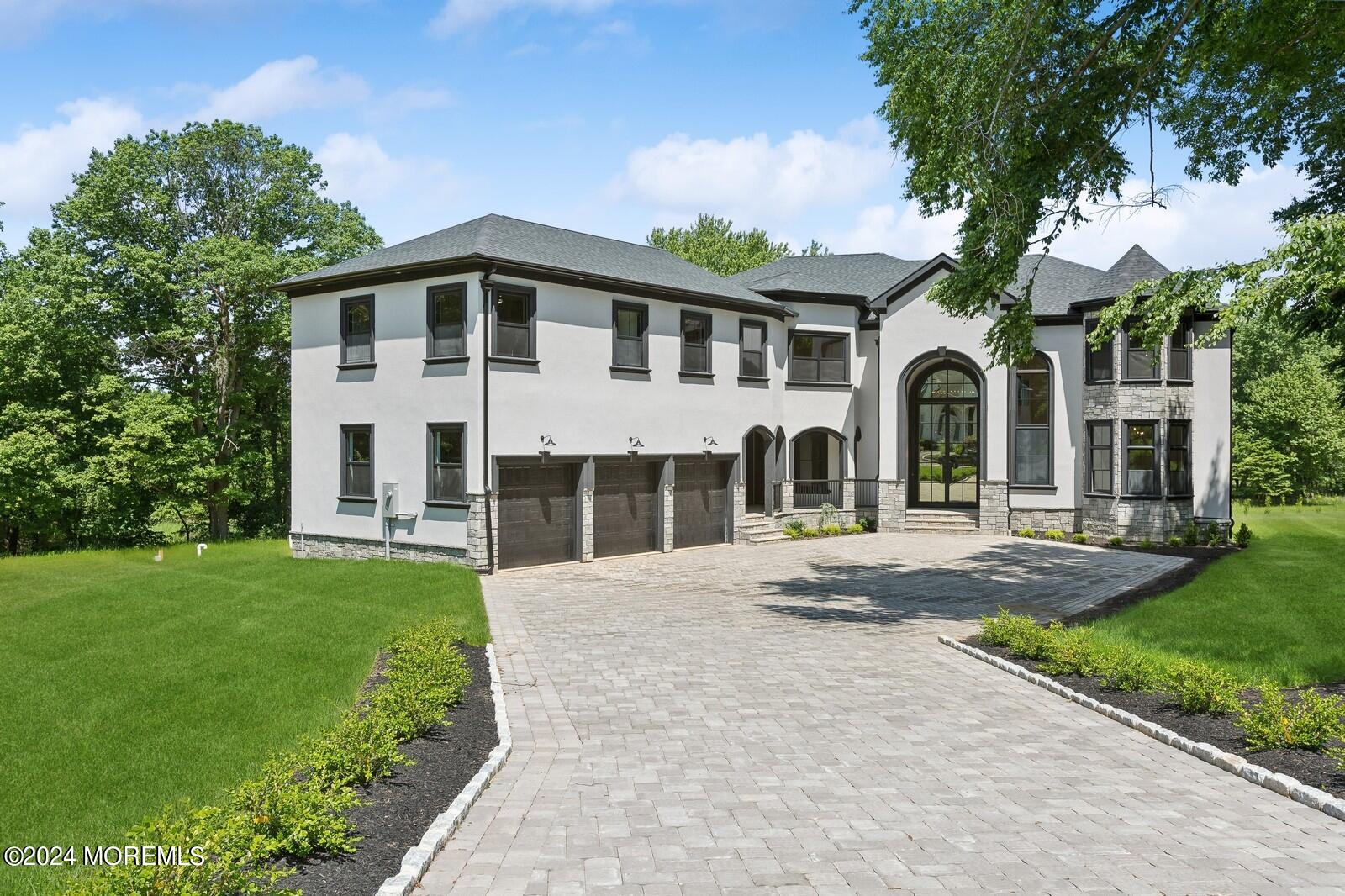 16 Round Hill Holmdel, NJ 07733 - Photo 2 of 60 front view of a house with a yard
