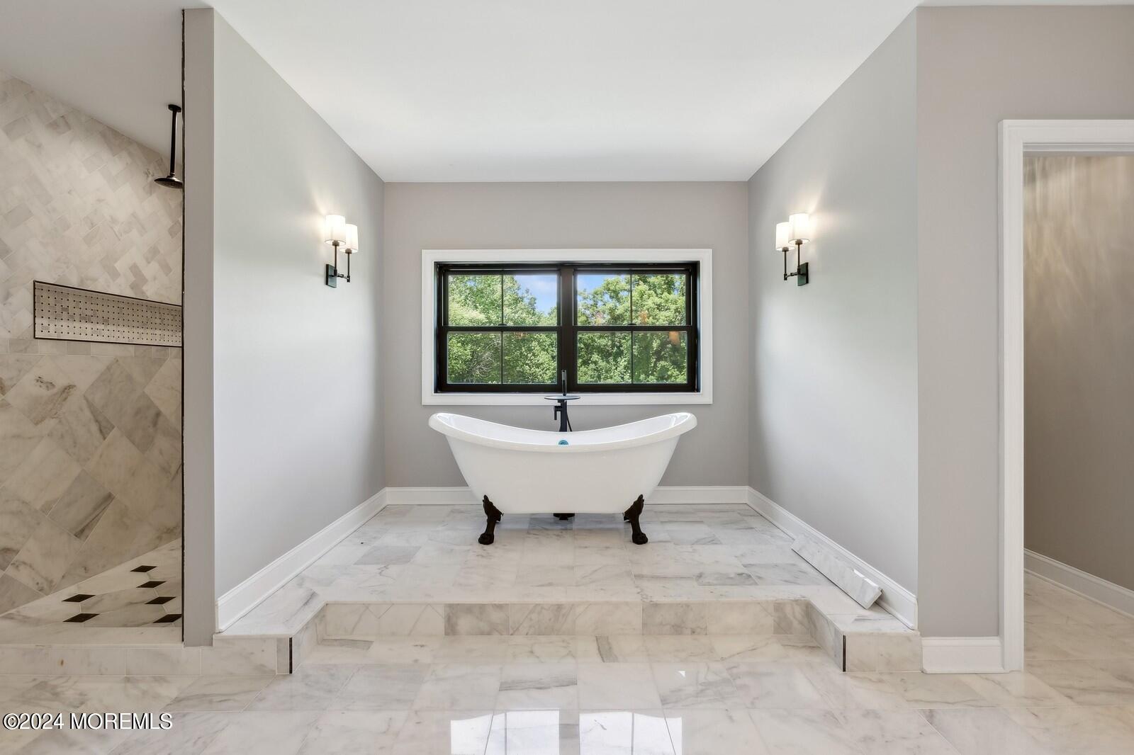 16 Round Hill Holmdel, NJ 07733 - Photo 34 of 60 a view of a bathtub in a room