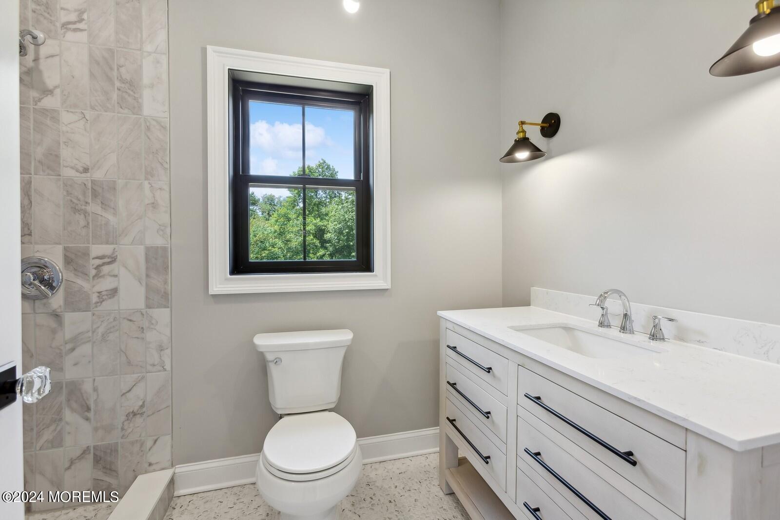 16 Round Hill Holmdel, NJ 07733 - Photo 36 of 60 a bathroom with a toilet sink and mirror