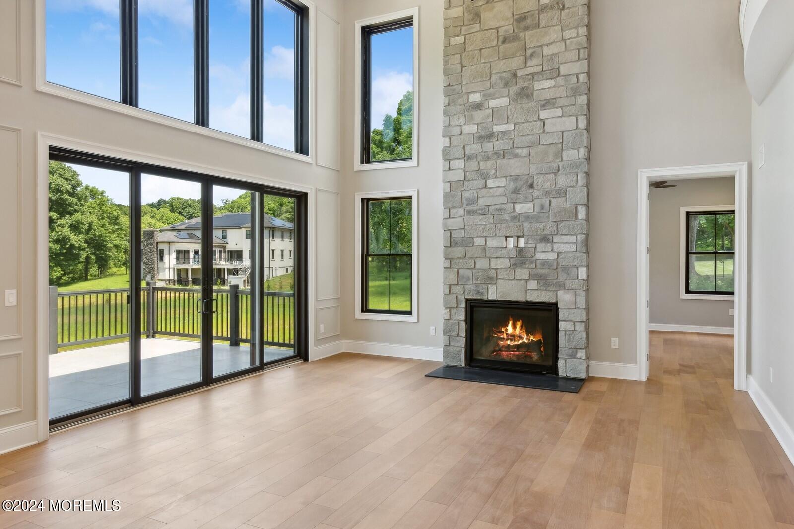 16 Round Hill Holmdel, NJ 07733 - Photo 10 of 60 a view of an empty room with a fireplace and a window