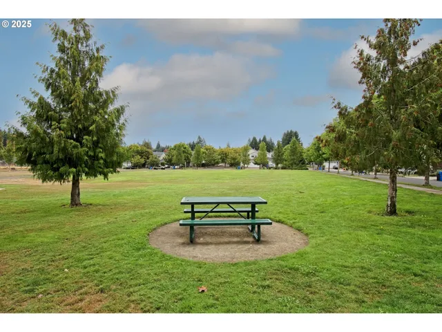 a view of a backyard with sitting area