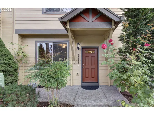 a view of a house with potted plants