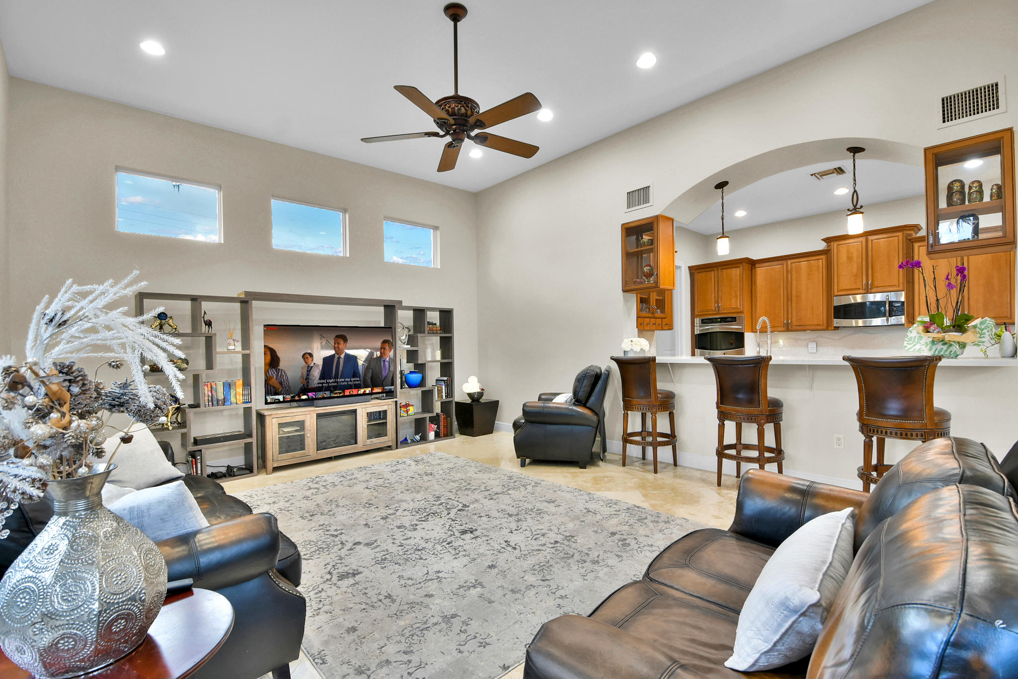 7100 Northeast 7th Avenue Boca Raton, FL 33487 - Photo 8 of 35 a living room with furniture and a flat screen tv