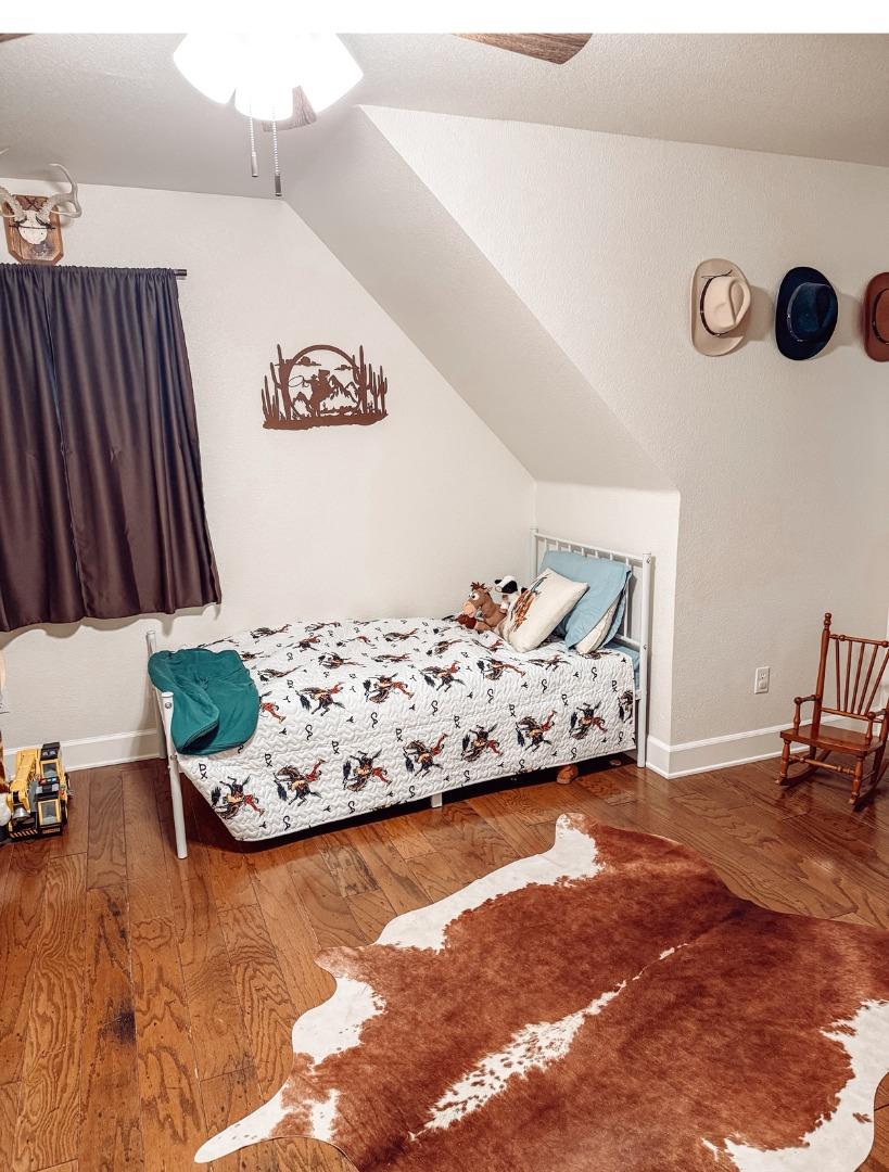 2253 Buffalo Way Copperopolis, CA 95228 - Photo 21 of 39 a bed room with a bed and a couch