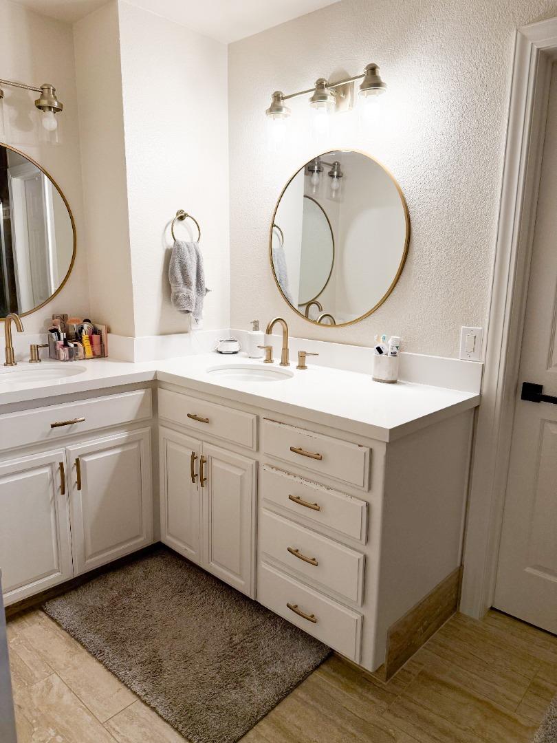 2253 Buffalo Way Copperopolis, CA 95228 - Photo 28 of 39 a bathroom with a double vanity sink and a mirror