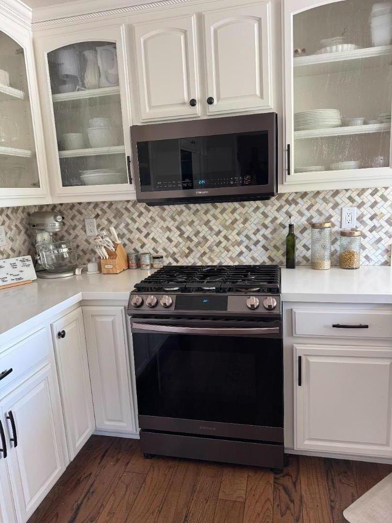 2253 Buffalo Way Copperopolis, CA 95228 - Photo 9 of 39 a white stove top oven sitting inside of a kitchen