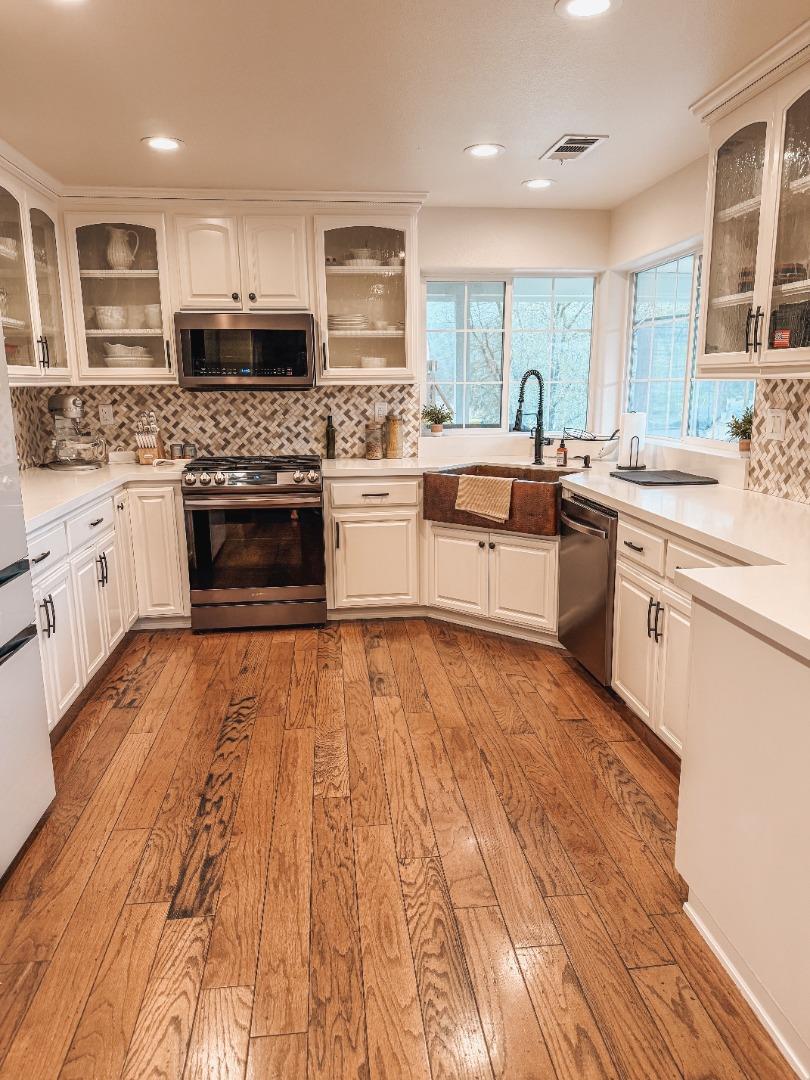 2253 Buffalo Way Copperopolis, CA 95228 - Photo 10 of 39 a large kitchen with stainless steel appliances granite countertop a stove and cabinets