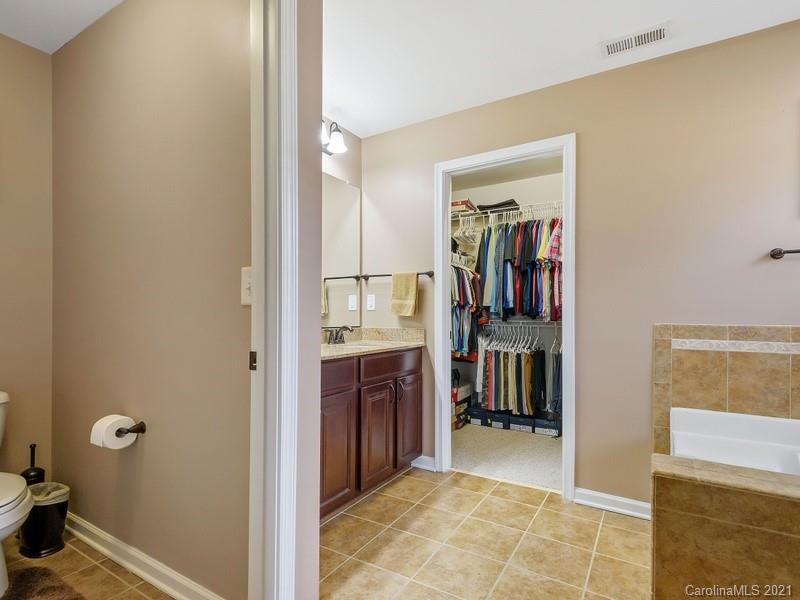 7726 Wiltshire Ridge Road Charlotte, NC 28269 - Photo 16 of 26 a view of a hallway with closet and bathroom