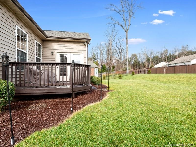 7726 Wiltshire Ridge Road Charlotte, NC 28269 - Photo 25 of 26 a view of a porch with a yard