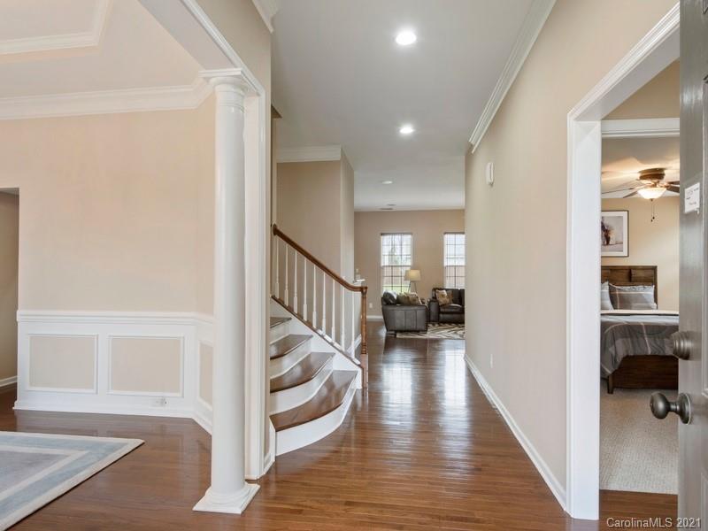 7726 Wiltshire Ridge Road Charlotte, NC 28269 - Photo 4 of 26 a view of entryway and hall with wooden floor