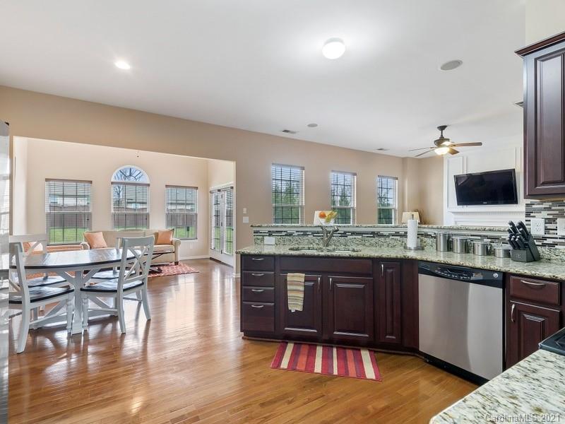 7726 Wiltshire Ridge Road Charlotte, NC 28269 - Photo 10 of 26 a large kitchen with lots of counter space and a sink