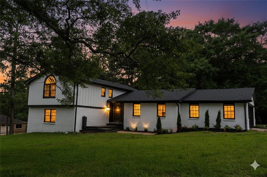 69 Hearn Road Ellenwood, GA 30294 - Photo 1 of 19 a front view of a house with a yard