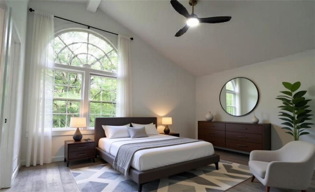 69 Hearn Road Ellenwood, GA 30294 - Photo 3 of 19 a bedroom with a bed mirror on desk and a window