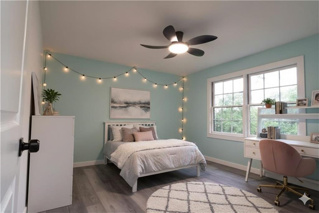 69 Hearn Road Ellenwood, GA 30294 - Photo 7 of 19 a bedroom with a bed and a window