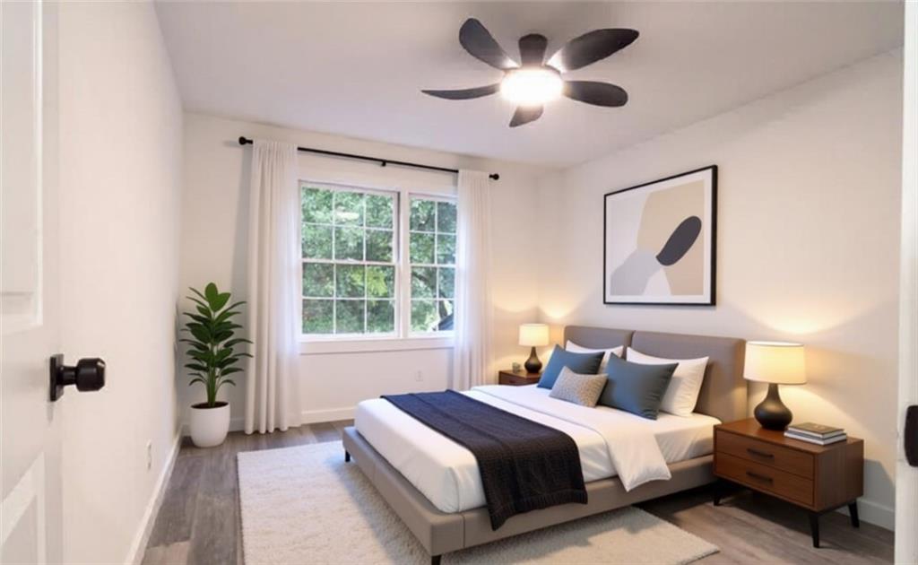 69 Hearn Road Ellenwood, GA 30294 - Photo 9 of 19 a bedroom with bed and a window