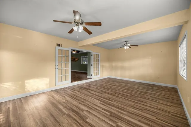 a view of room with wooden floor