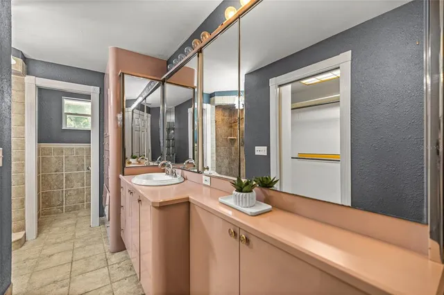 a view of a chair and table and chairs with the trees in the background