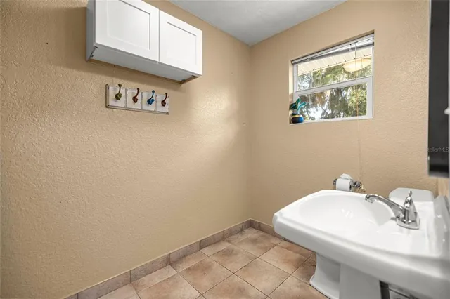 a view of a house with a yard porch and sitting area