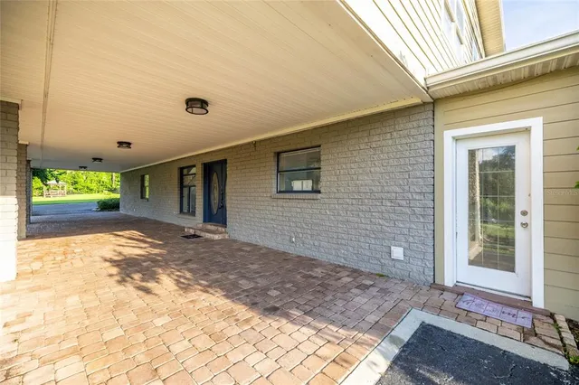a living room with fireplace furniture and a wooden floor