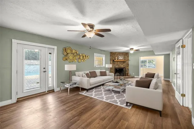 a living room with chairs and a table