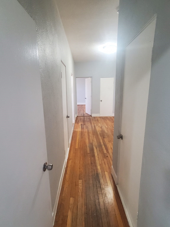 10 Abbotsford Street, Unit 9 Boston, MA 02121 - Photo 14 of 14 a view of a hallway with wooden floor
