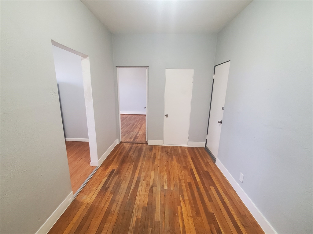 10 Abbotsford Street, Unit 9 Boston, MA 02121 - Photo 5 of 14 a view of wooden floor in a room
