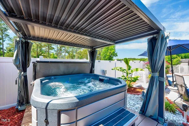 a wooden bench sitting in front of a house