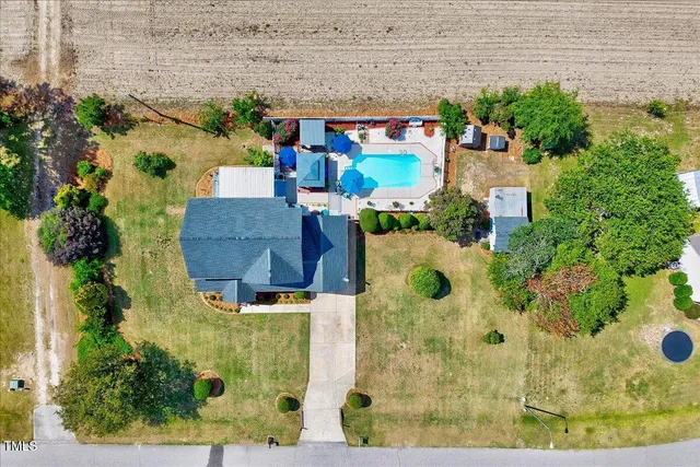aerial view of a house with a yard
