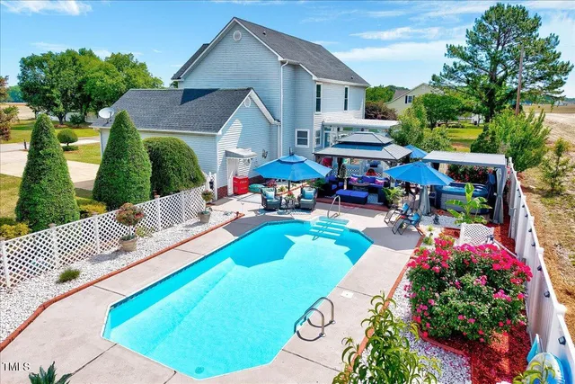 a view of a house with swimming pool