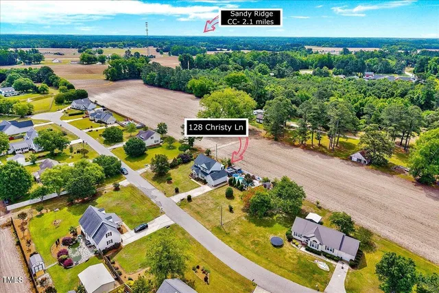 an aerial view of a house with a garden