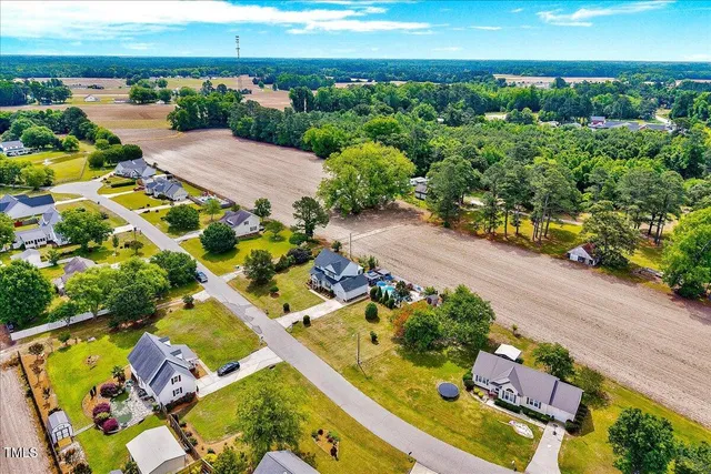 an aerial view of a house with a garden