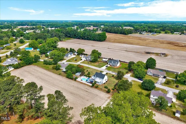 an aerial view of a house with a garden