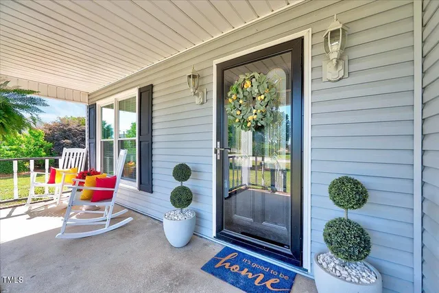 a backyard of a house with outdoor seating