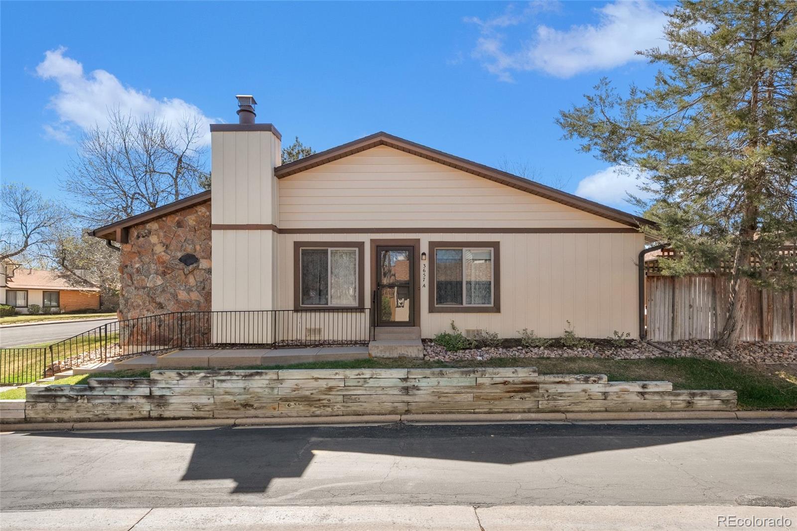 3657 South Laredo Street, Unit A Aurora, CO 80013 - Photo 1 of 26 a front view of a house