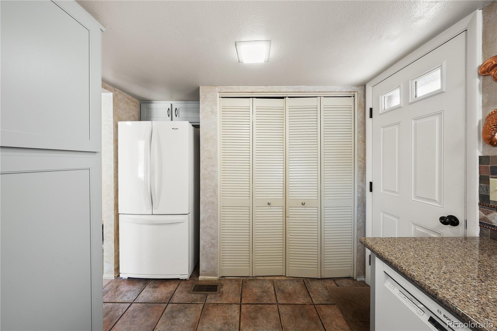 3657 South Laredo Street, Unit A Aurora, CO 80013 - Photo 13 of 26 a bathroom with a granite countertop shower and a sink