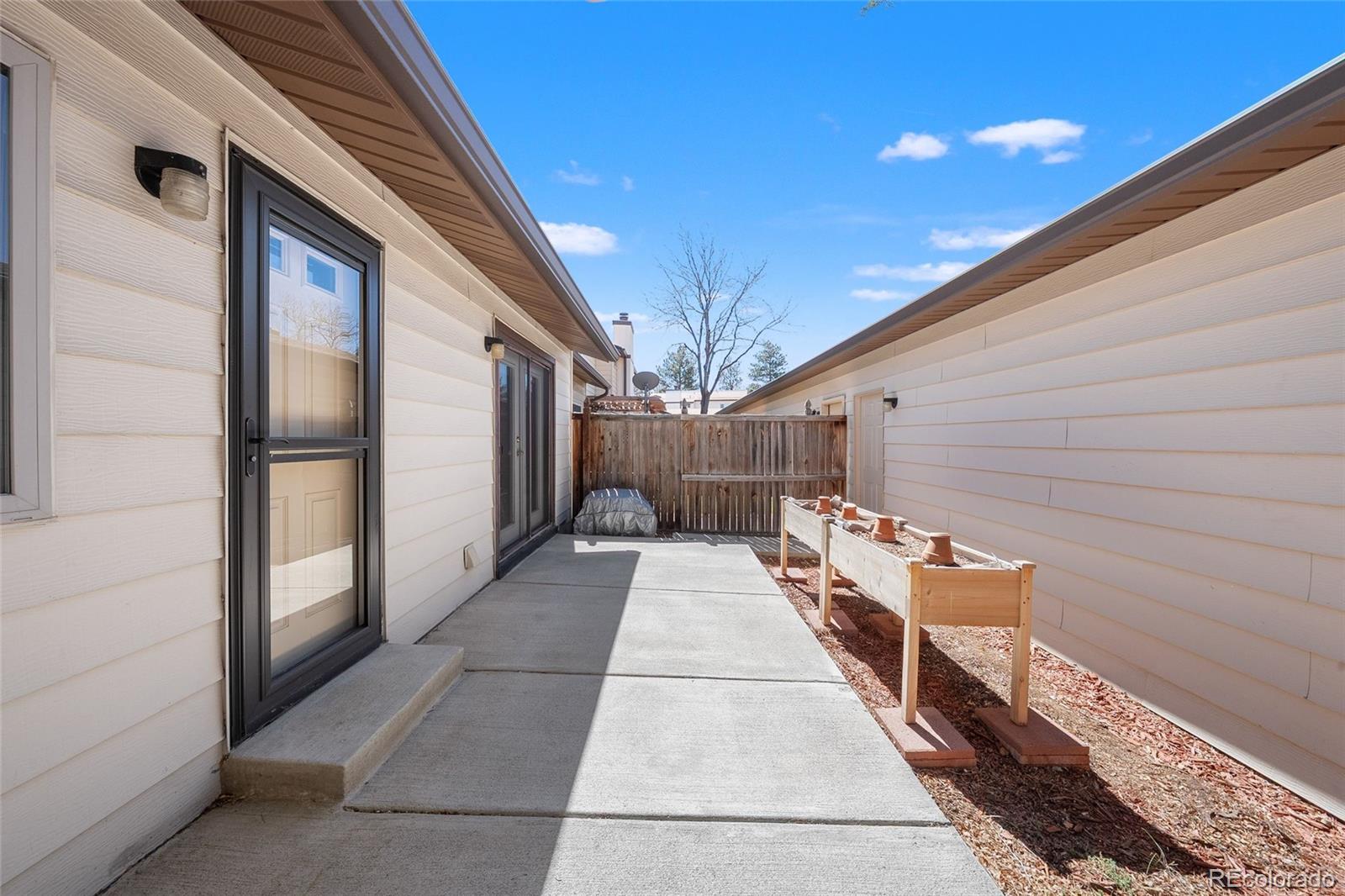 3657 South Laredo Street, Unit A Aurora, CO 80013 - Photo 24 of 26 a backyard of a house with seating space