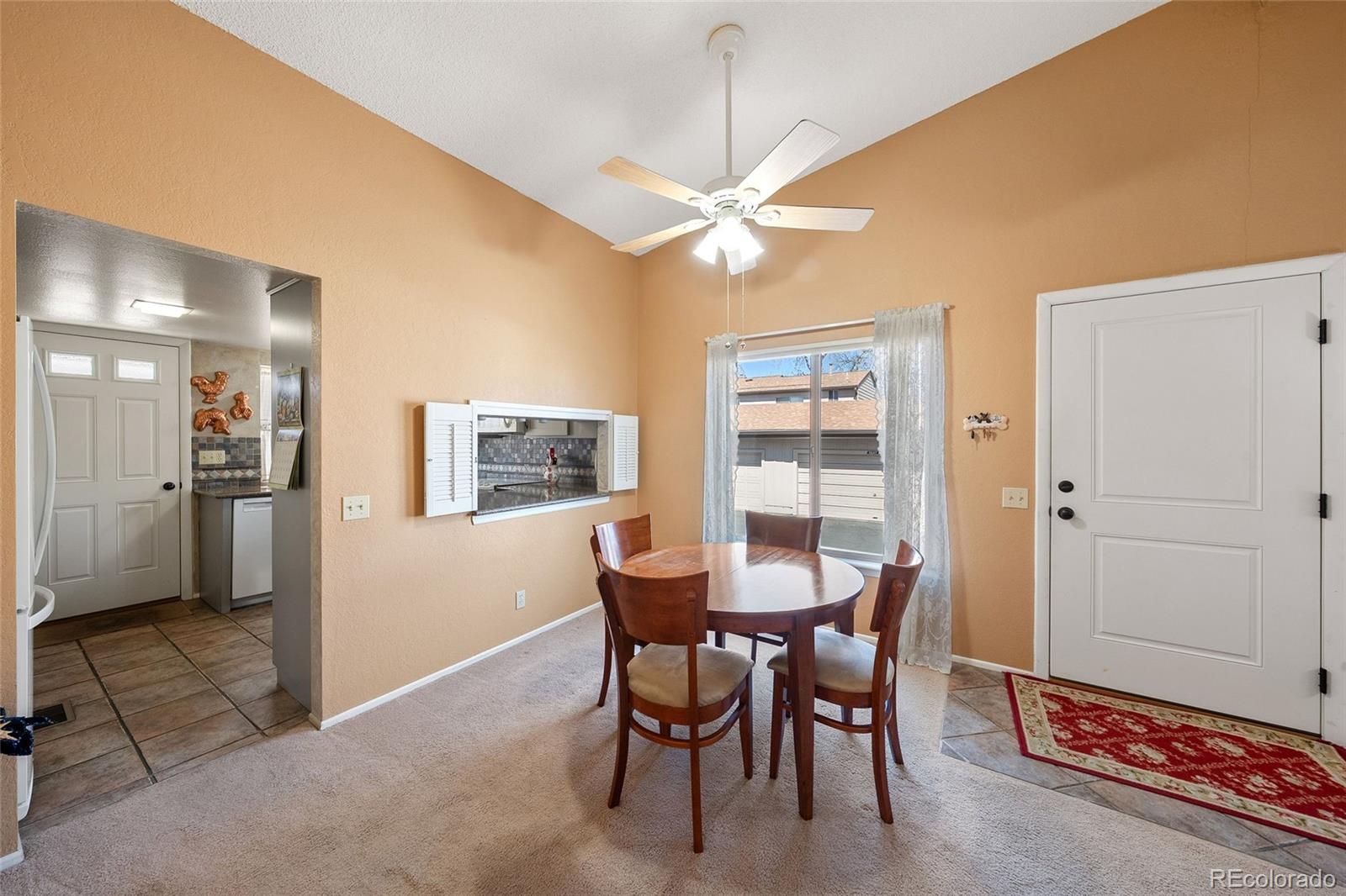 3657 South Laredo Street, Unit A Aurora, CO 80013 - Photo 3 of 26 a dining room with furniture and window