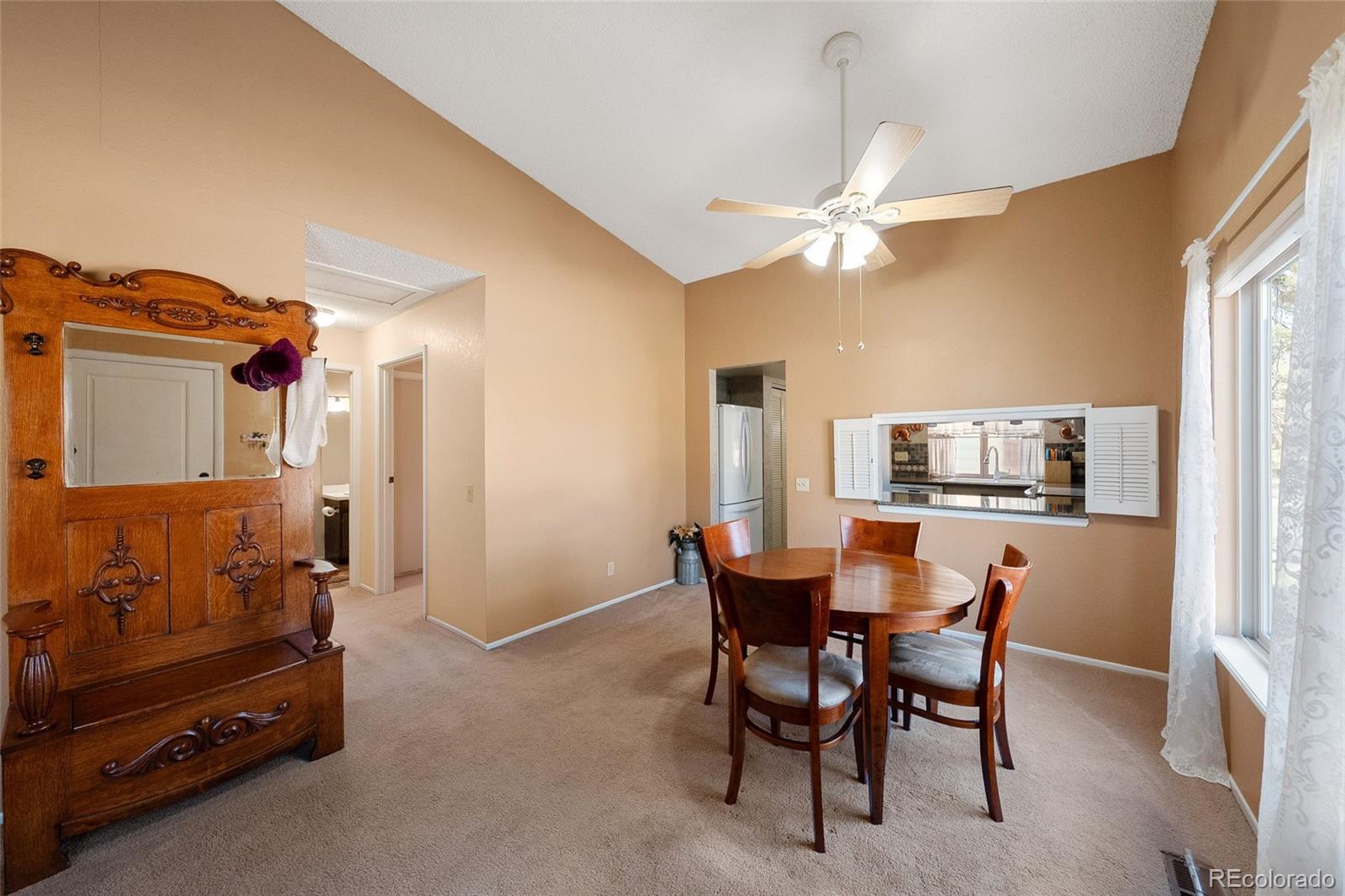 3657 South Laredo Street, Unit A Aurora, CO 80013 - Photo 4 of 26 a dining room with furniture and window