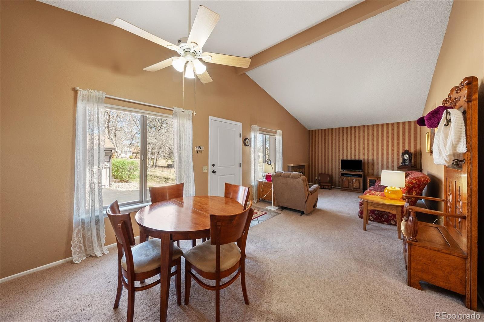 3657 South Laredo Street, Unit A Aurora, CO 80013 - Photo 5 of 26 a dining room with furniture and window